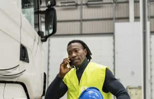 African american truck driver talking on the phone